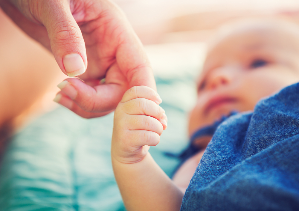 Cute,Newborn,Baby,Holding,Mother's,Hand